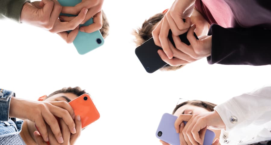 Teens using cell phones to access social media sites in Jacksonville